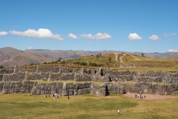Visit the curving walls of Sacsayhuaman in the Andes mountaing range during your Peru tour