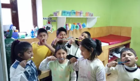 Children at Mantay brushing their teeth