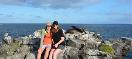Posing with a napping sea lion on South Plaza Island.