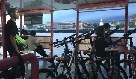 Taking the ferry across the river on our bike tour