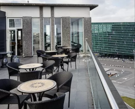 Outdoor patio seating with views of Harpa