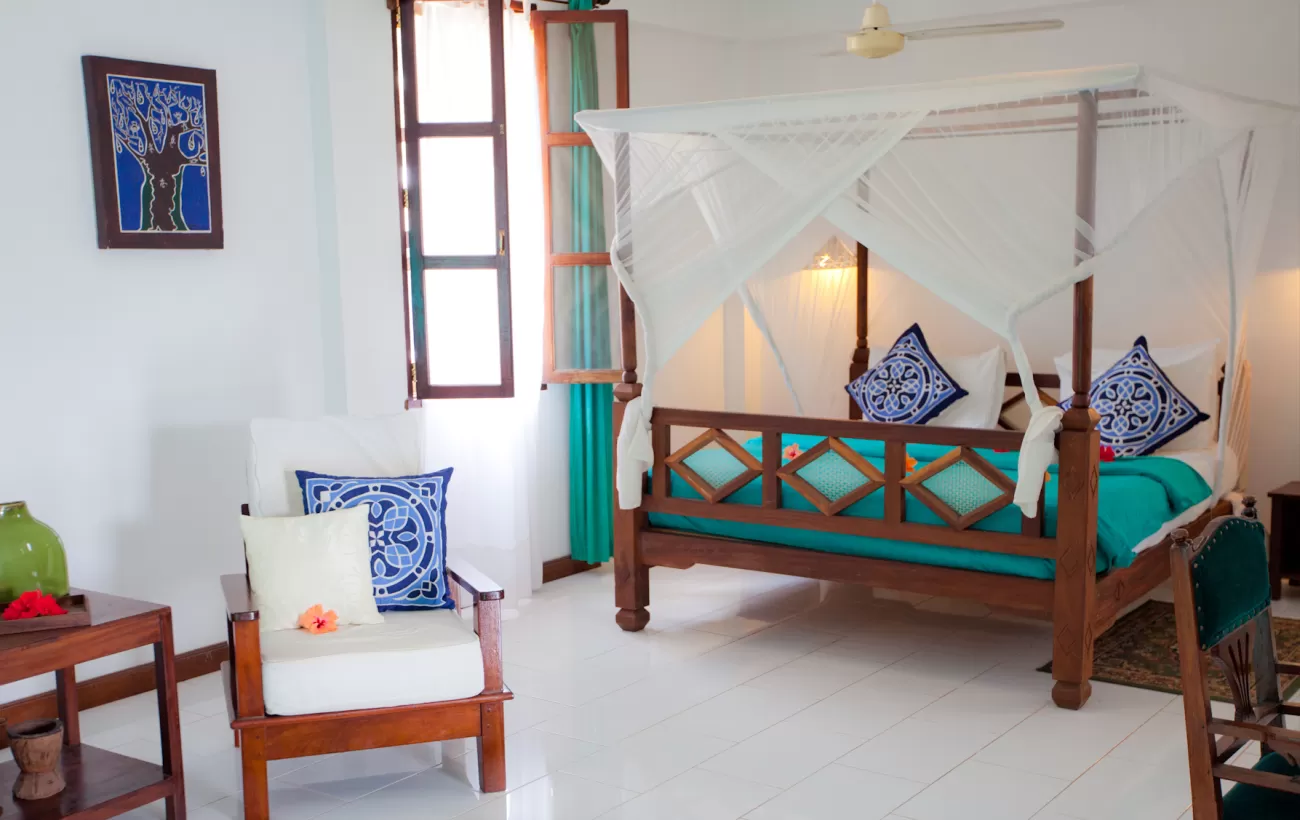 Bedroom at Flame Tree Cottages