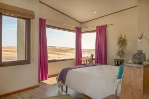 Wake up to sweeping views of the Namibian desert