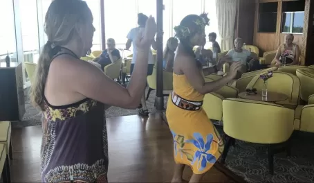 Sister participates in a Polynesian dance lesson