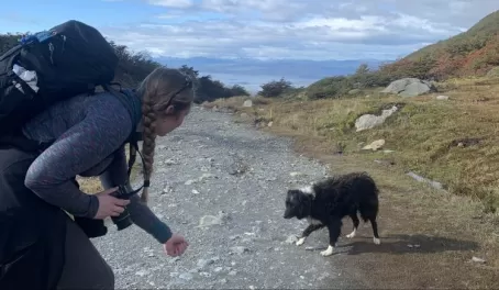 Meg greets a friendly pupper on the Glacier Martial trail