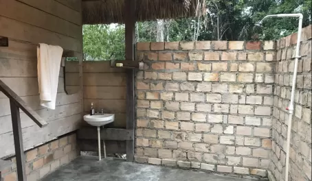 A refreshing open-air shower and bathroom facilities
