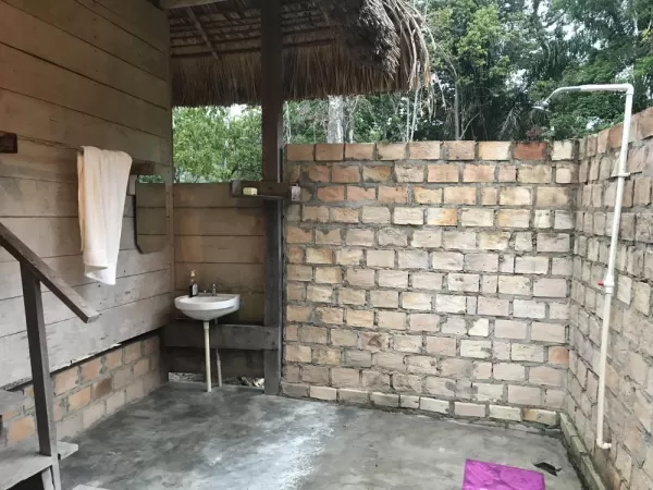 A refreshing open-air shower and bathroom facilities