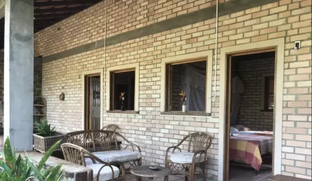 A peek into the rooms and outdoor verandas of Rock View Lodge