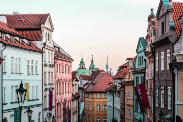 Explore the charming pastel-colored streets of Prague