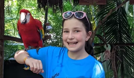 Samantha with a macaw at Puerto Vallarta wildlife area