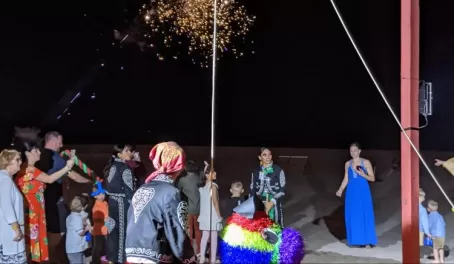 Pinata and fireworks at Mexican fiesta