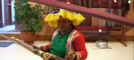A weaver at the textile center in Cusco