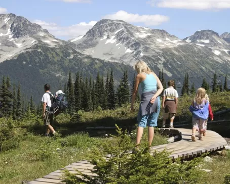 Family hiking on a tour of Alaska