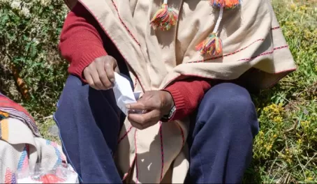 The lodge's Quechua priest, Sebastian, preparing an offering to the Andes.