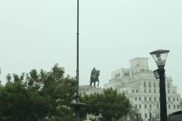 Statue rising from the fog in the center of Lima