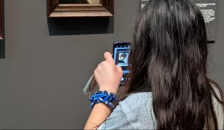 Taking a photograph of Rembrandt's Self Portrait