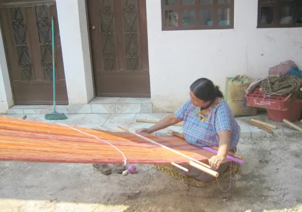 Maya woman weaving on Guatemala tour