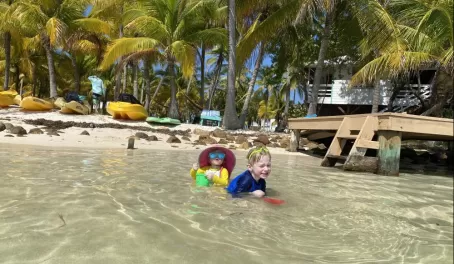 Playing in the warm shallow water on South Water Caye