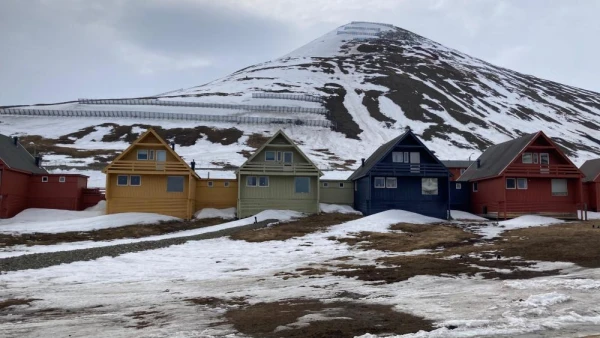Longyearbyen homes, ice melted, in Svalbard archipelago, Norway