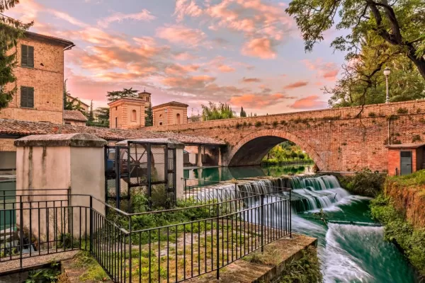ancient bridge, canal of the old mills and waterfalls in the medieval town of Bevagna