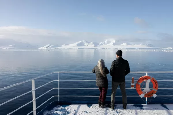 Travelers enjoying the majestic view in Antarctica