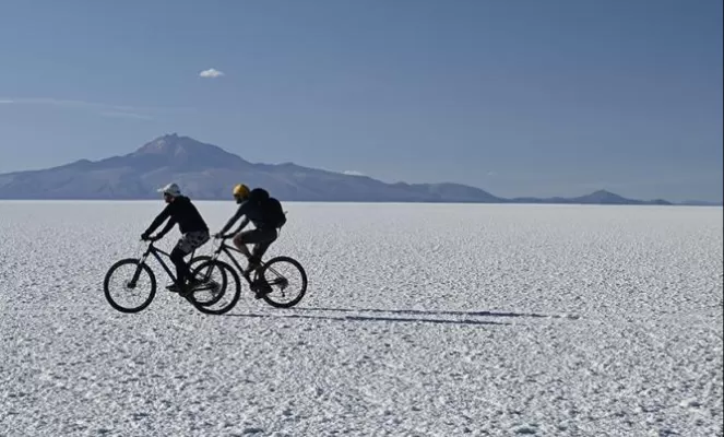 Biking in the largest salt flat in the world, in Uyuni, Bolivia