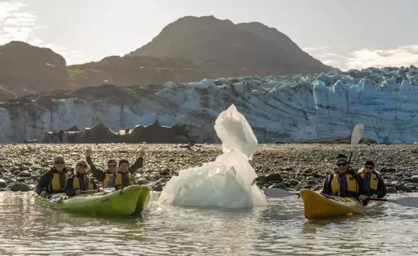 Kayaking in front of Lamplugh Glacier