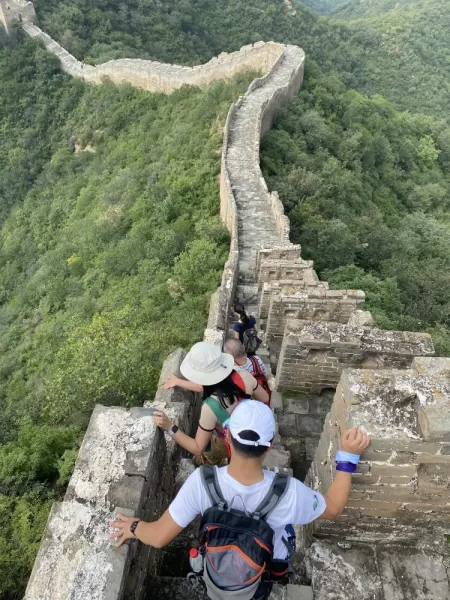 Climbing down a steep section of the Great Wall
