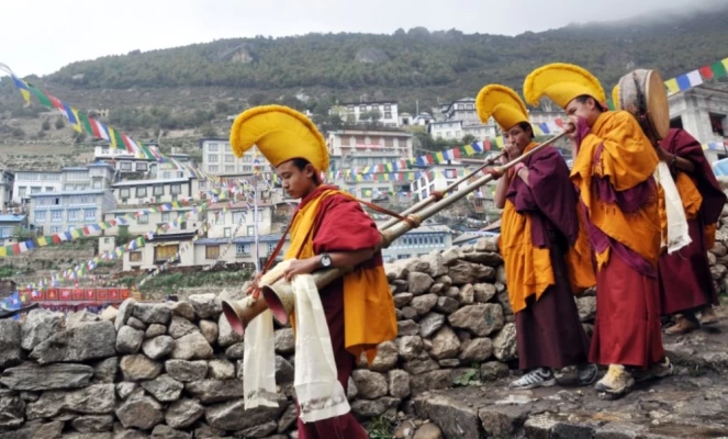 Praying monks in Namche, Himalayan Mountains in Nepal