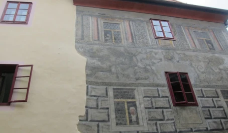 Traditional relief wall paintings uncovered in most buildings in the whimsical town of Cesky Krumlov