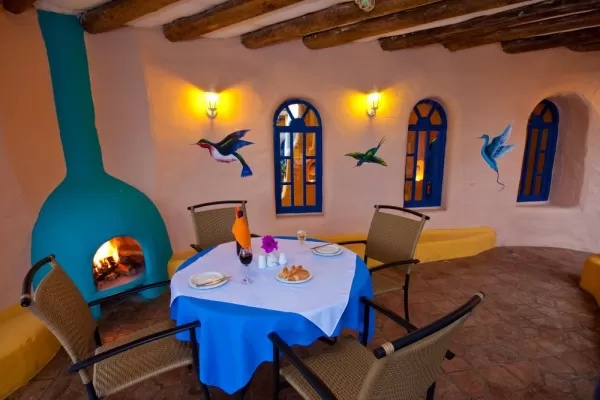 A cozy fireside meal for cold nights at Mantaraya Lodge