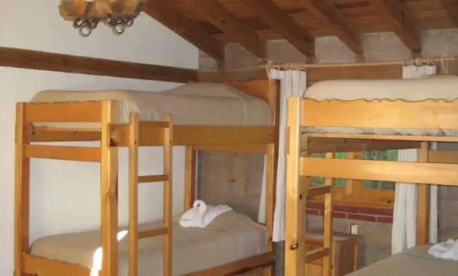 Accommodations are warm and welcoming with bunk beds and shared bathrooms