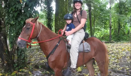 Family horseback ride through the Costa Rican rainforest