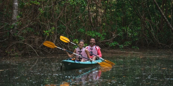 Happy couple kayaking in Corcovado National Park, Osa Peninsula
