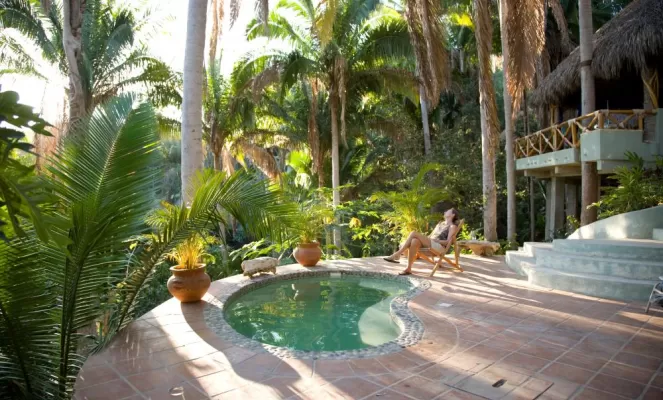 Soak in the tropics next to the pool