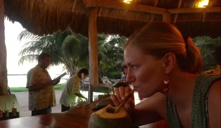 Drinking cocktails from a coconut