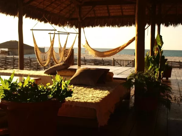 Watch the sun linger over the ocean at Soak in the afternoon sun on your private deck at Vila Bela Vista