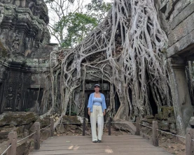 Jane in front of tree at ta prohm temple
