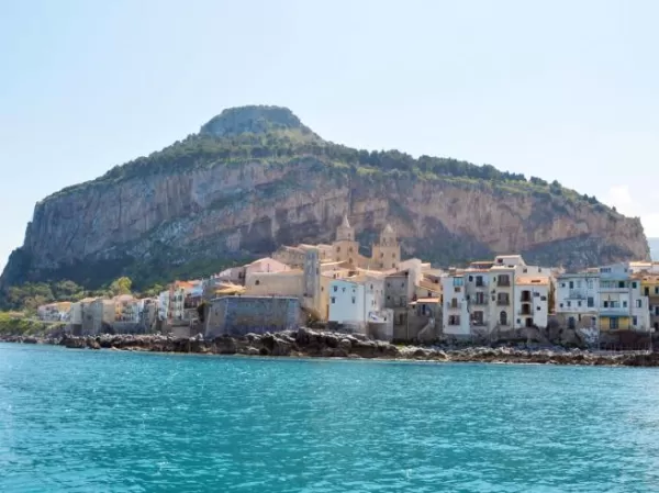 Sail past the port of Cefalu on your Sicilian cruise