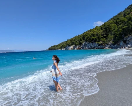 A beautiful beach on Skopelos Island, surrounded by crystal-clear Aegean waters and lush Mediterranean scenery.