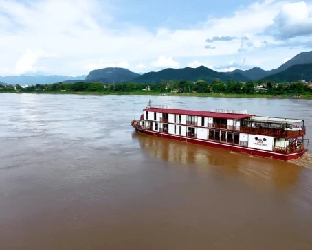 Heritage Line Anouvong luxury cruise ship sailing on the Upper Mekong River in Laos
