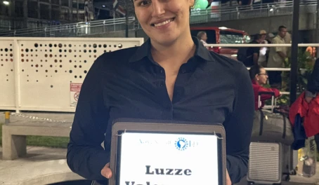 Alexandra with airport pickup sign