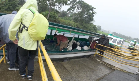 Getting our bags on the boat to the lodge