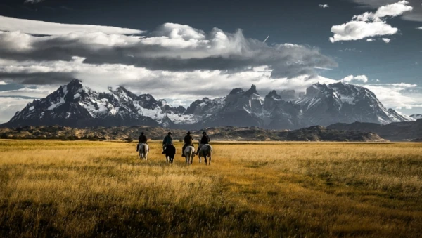 Travelers riding  through the Grey Glacier sector in Patagonia