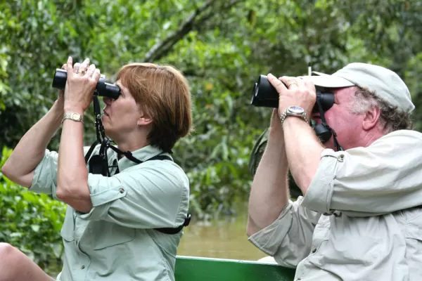 Traveler's looking at local wildlife through binoculars.