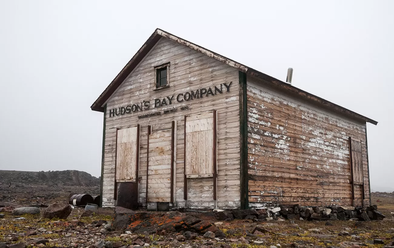 An old run down building with the Hudson's Bay Company sign on it.