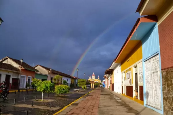 A rainbow crosses over the cathedral in Granada.