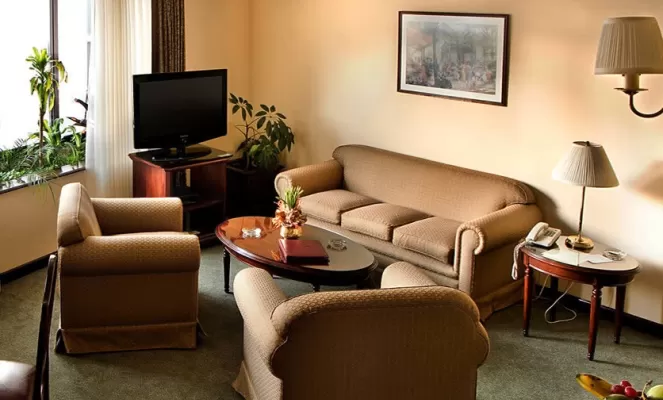 Comfortable seating area in your Grand Deluxe room at Ritz Apart
