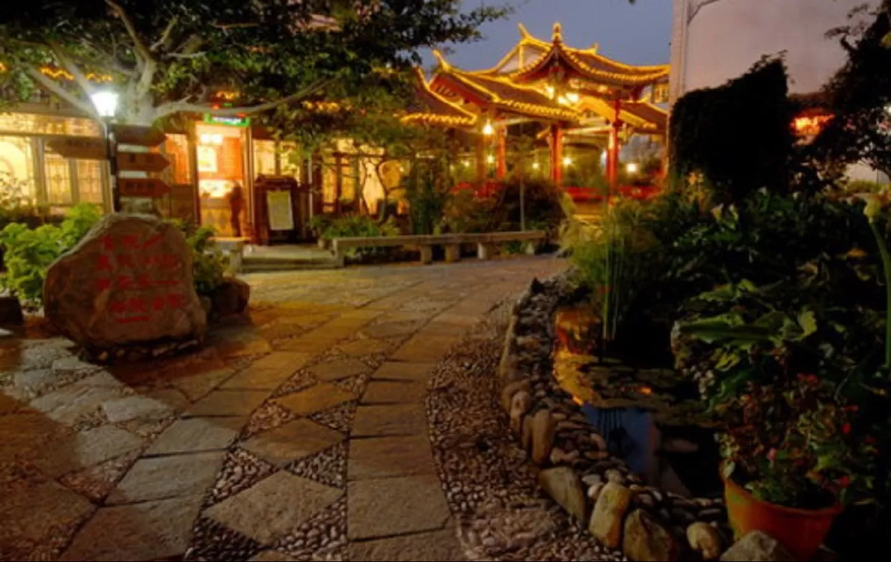 Outdoor night view of the Landscape Hotel and premises